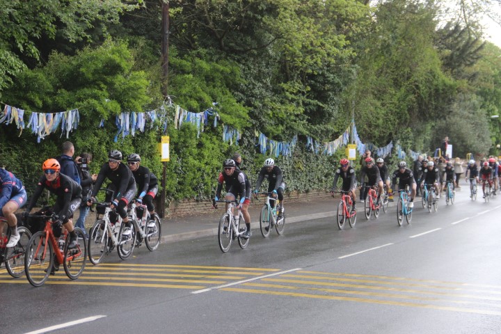 Picture of cyclist riding through the village